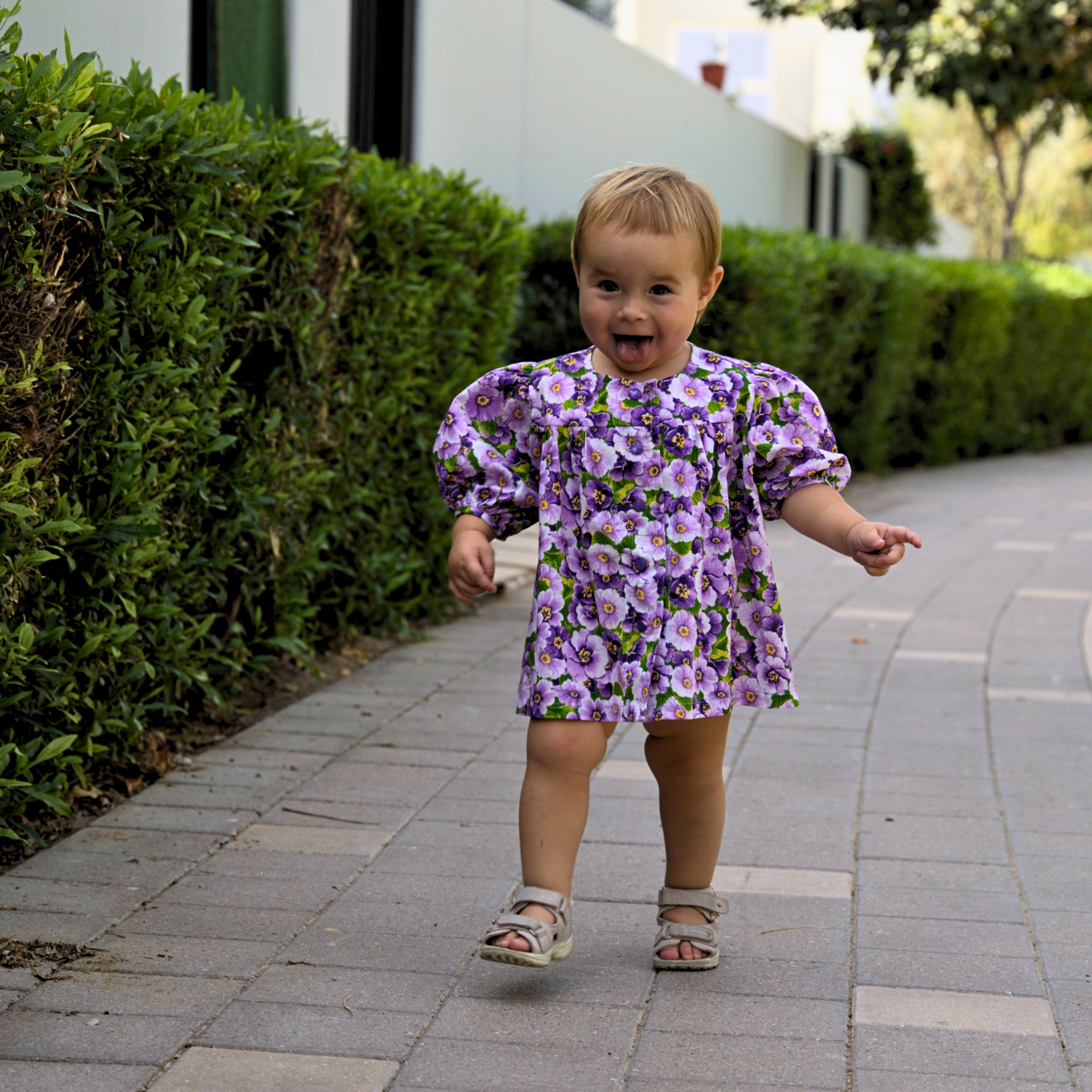 Lily Long dress by ItFits.ae, featuring a flowing silhouette with floral patterns and elegant design details.