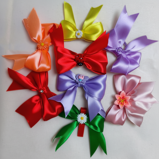 Set of two decorative ribbon bows from ItFits.ae, featuring colorful fabric with tied bow design for gift wrapping or crafts.