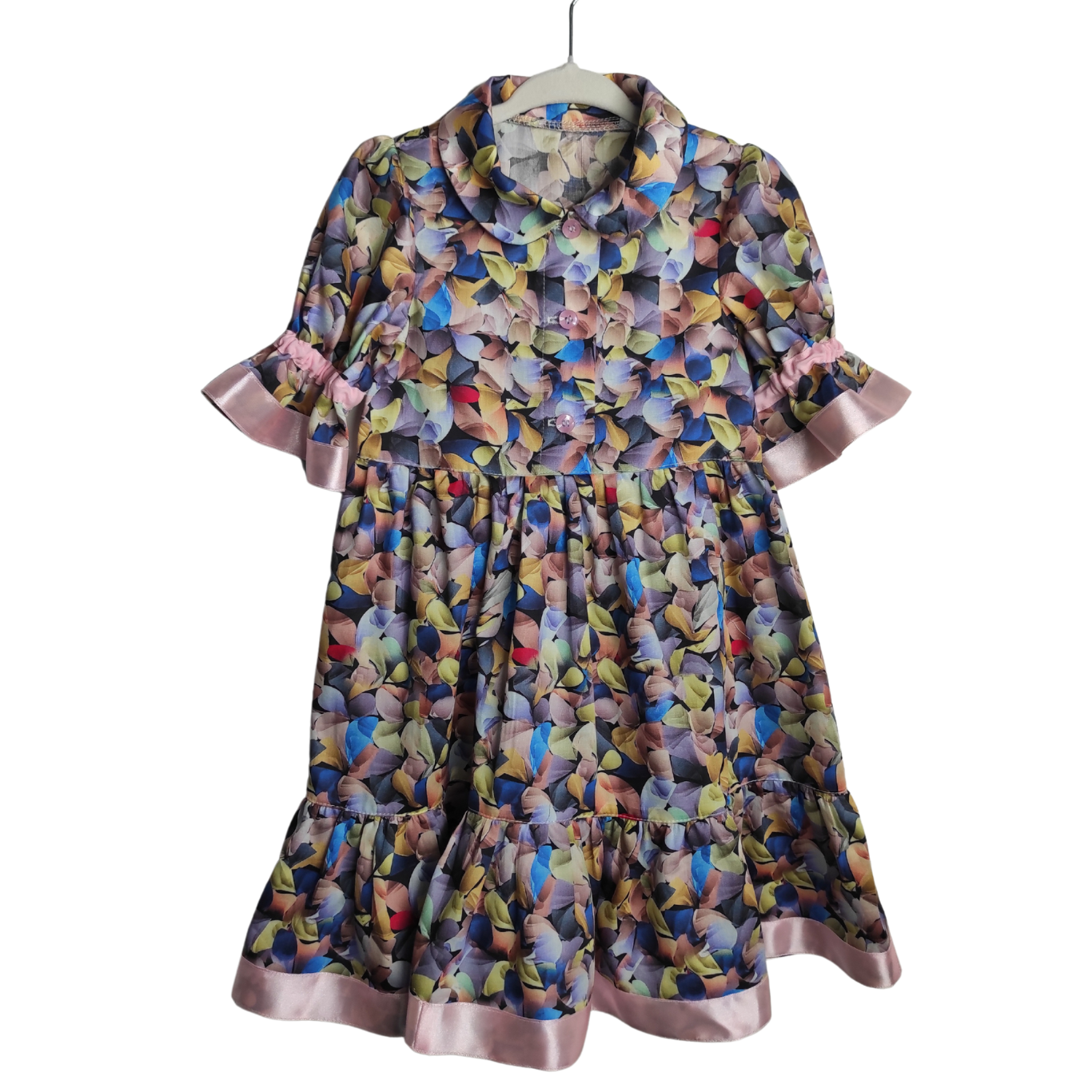 ItFits.ae Tutti Frutti satin-trim twirl dress with colorful fruit print and flowing fabric, perfect for summer or casual wear.
