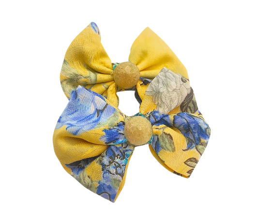 Set of two Sunny Hair Bows from ItFits.ae featuring bright yellow fabric with knot detail, perfect for children's hairstyles.