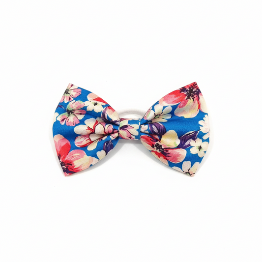 Colorful Flower Fantasy fabric bows from ItFits.ae, featuring vibrant floral designs and soft fabric material.
