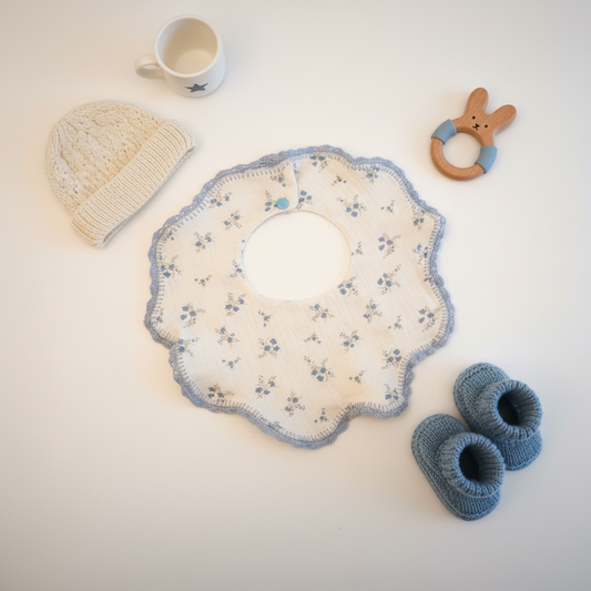 Baby bib from ItFits.ae, soft fabric with colorful patterns, designed to keep little clothes clean during feeding.