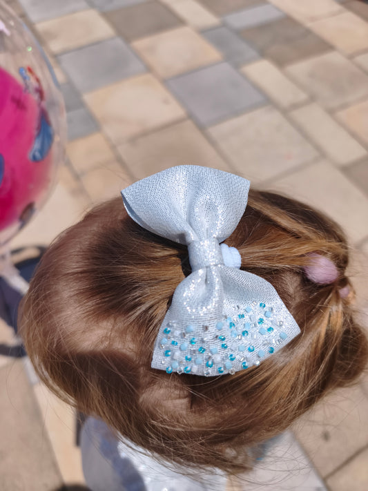 Frozen bow hair accessory by ItFits.ae featuring a shimmering icy design with intricate detailing.