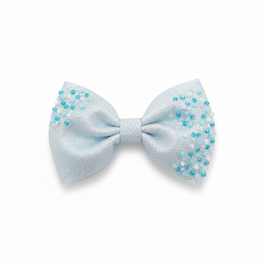 Frozen bow from ItFits.ae, a decorative hair accessory with a large, icy blue design suitable for various hairstyles.